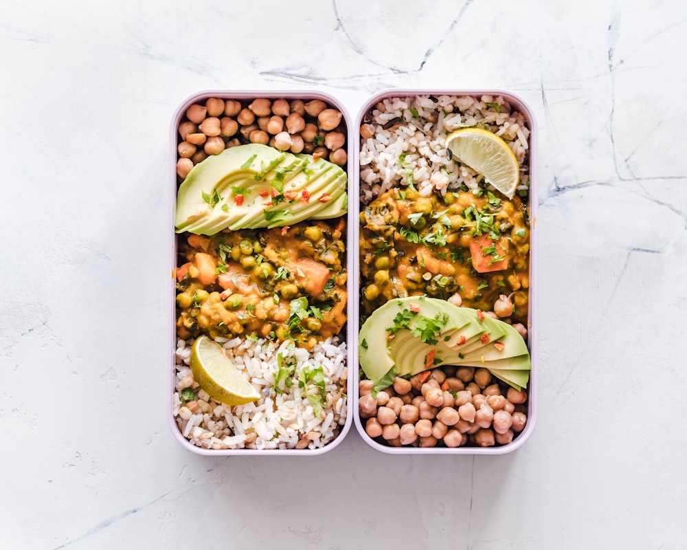 Organized meal prep containers with fresh vegetables and grains